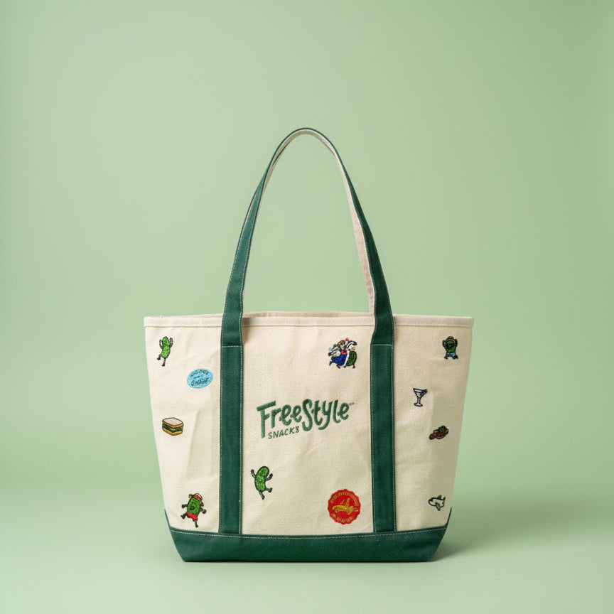 Tote bag with 'Freestyle' branding and various icons on a green background