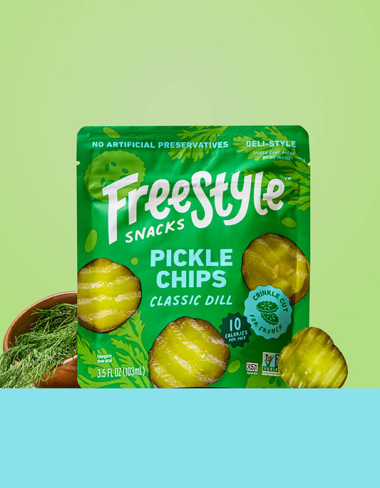 Freestyle Snacks Pickle Chips Classic Dill packaging on a green and blue gradient background