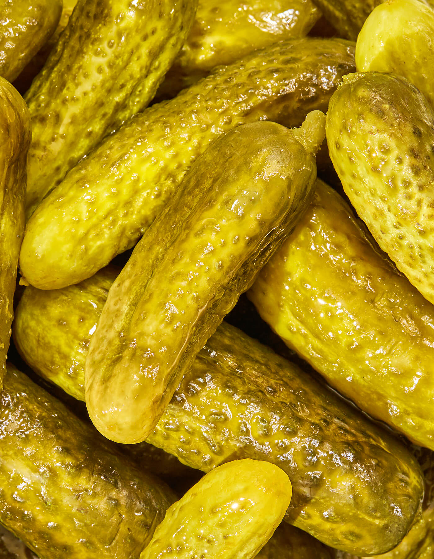 Close-up of Freestyle Snacks Garlic Dill Mini Pickles, highlighting texture and color.