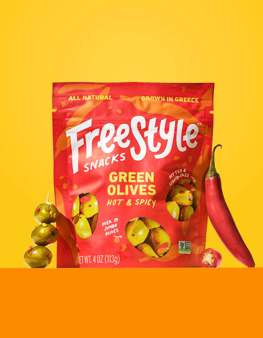 Bag of Freestyle Snacks Green Olives Hot & Spicy on a yellow background