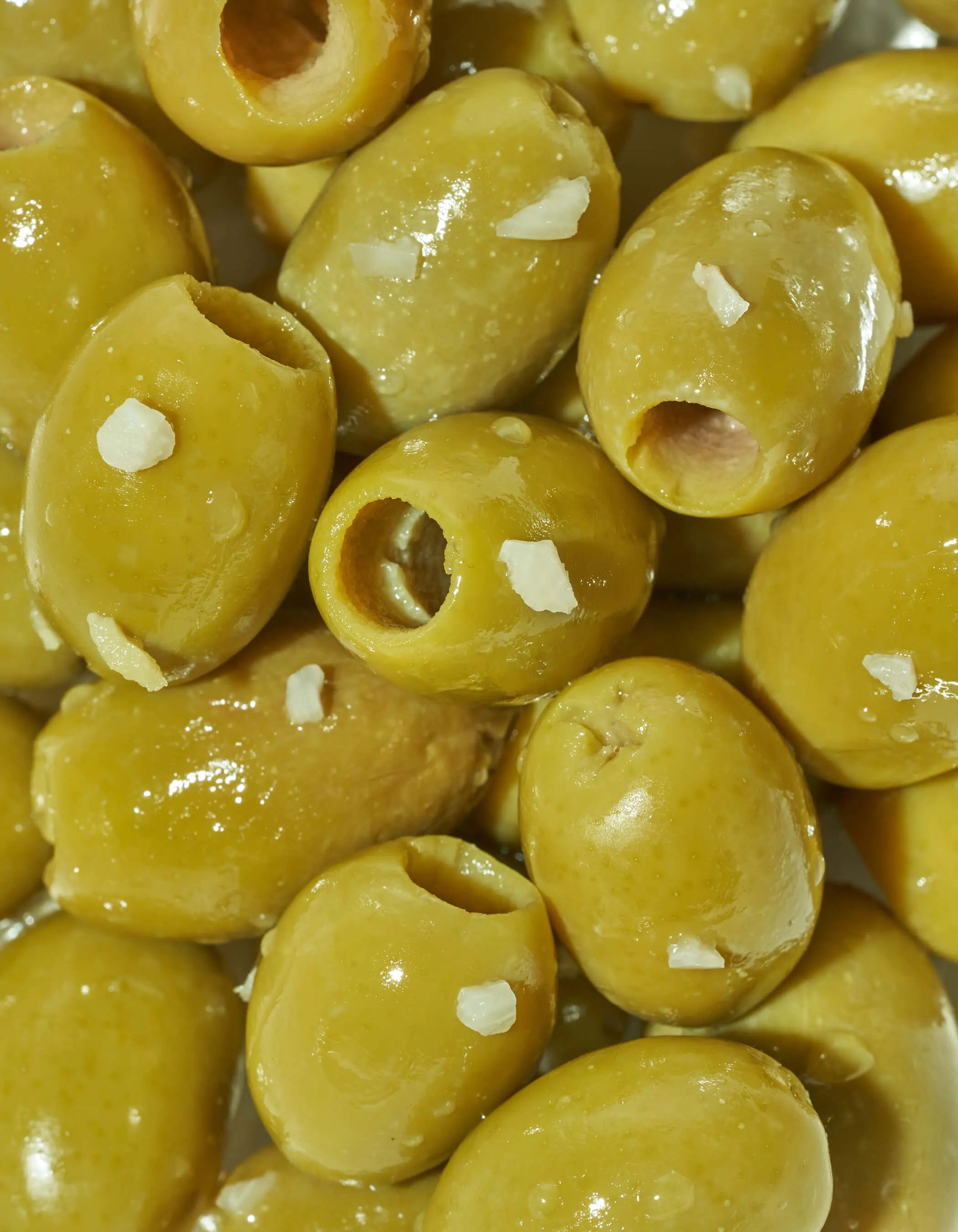 Close up shot of olives highlighting color and texture
