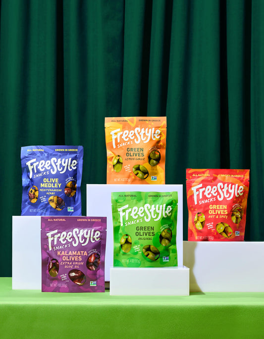 Freestyle Snacks Olive Starter Pack line up on a green background